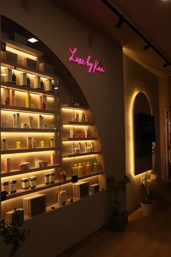 Skulpted by Kan product wall — luxury skincare clinic